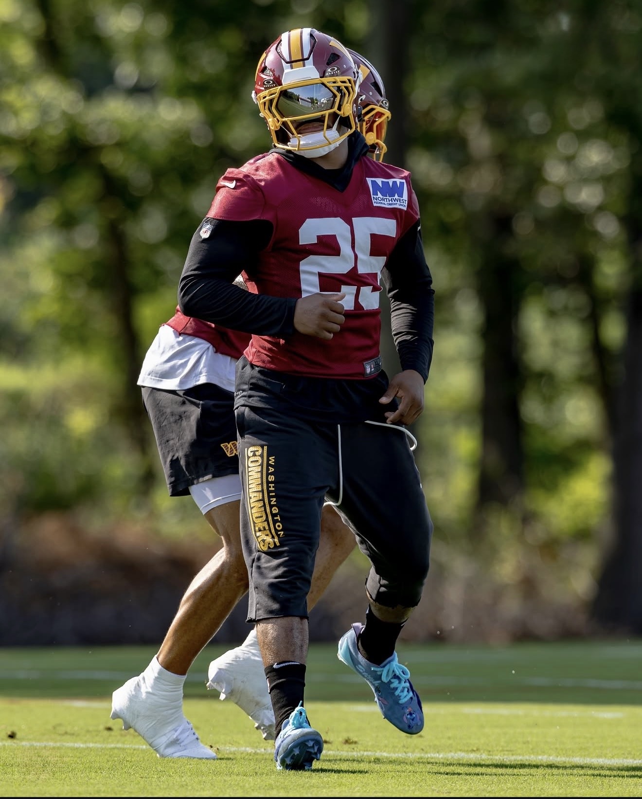 Nick Cross running a drill at Washington Commanders training camp