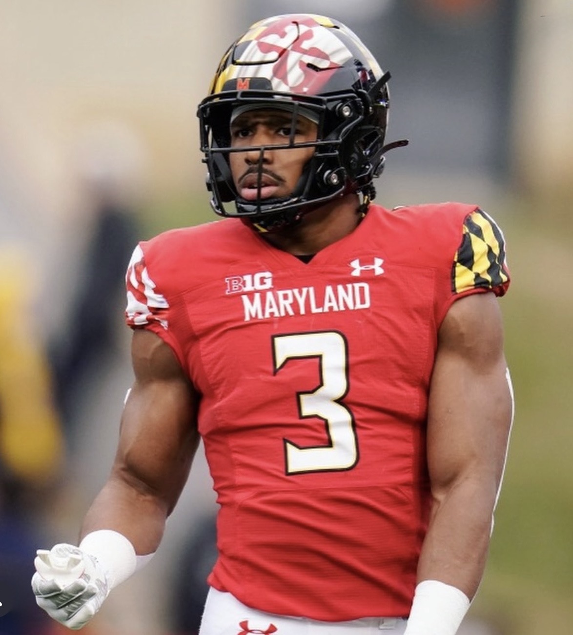 Nick Cross facing the camera in his red Maryland number 3 uniform and Terrapins flag helmet